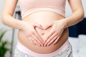 Pregnant Mother Holding Belly - Arizona Adoption Help