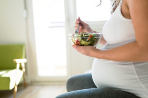 Pregnant Woman Eating Salad At Home – Phoenix, AZ – Arizona Adoption Help