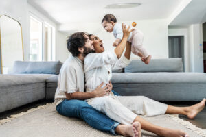 A Married Couple is Playing with Her Baby — Phoenix, AZ — Arizona Adoption Help